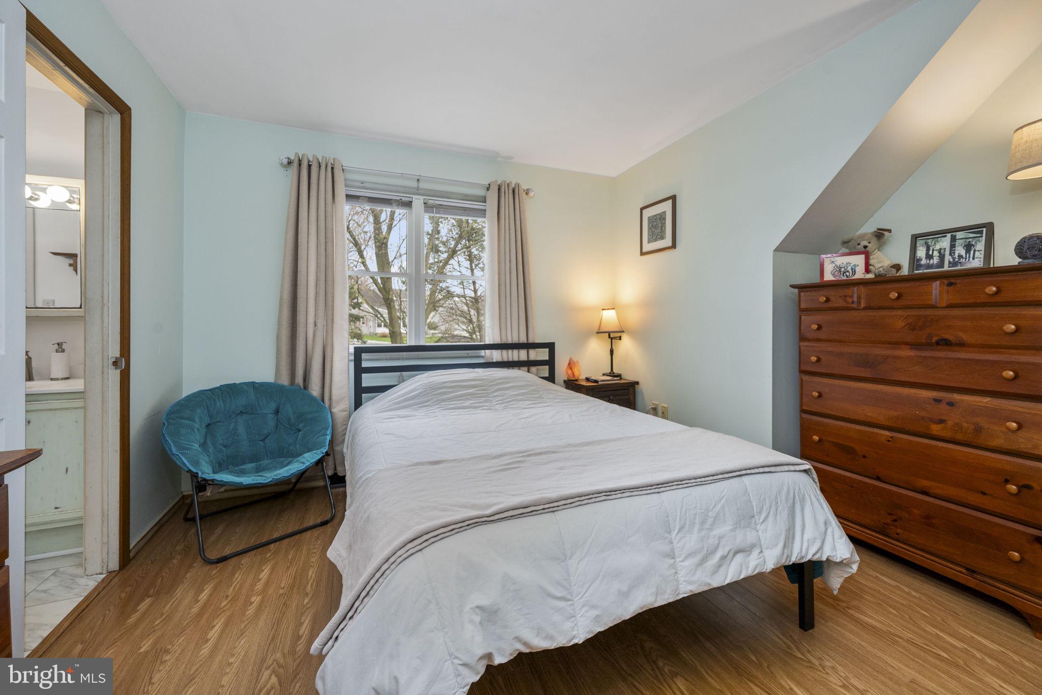 558 Crosswinds Drive Lititz, PA 17543 - Photo 16 of 31 a bedroom with a bed a dresser and a window