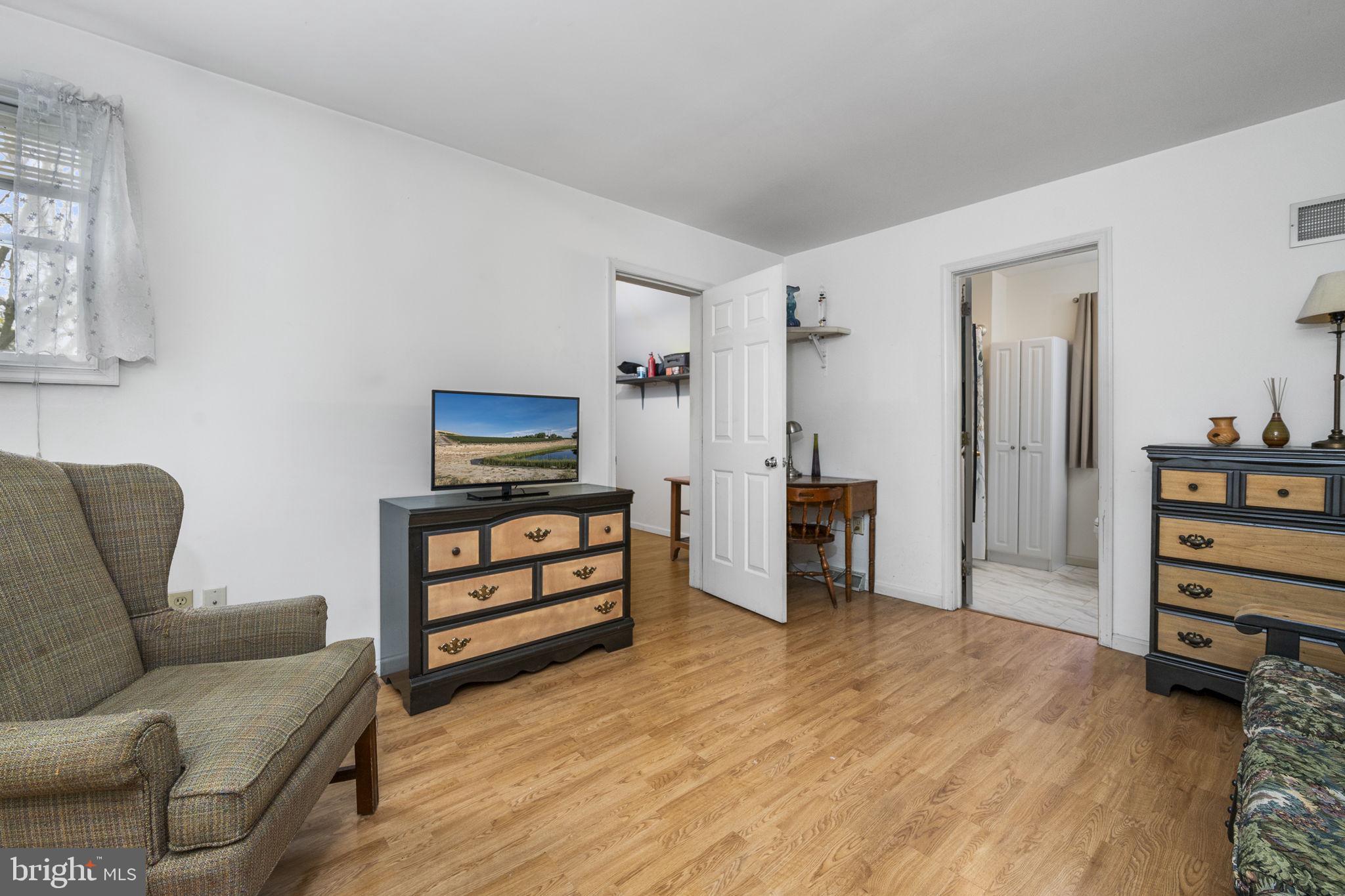 558 Crosswinds Drive Lititz, PA 17543 - Photo 18 of 31 a living room with furniture and a dresser