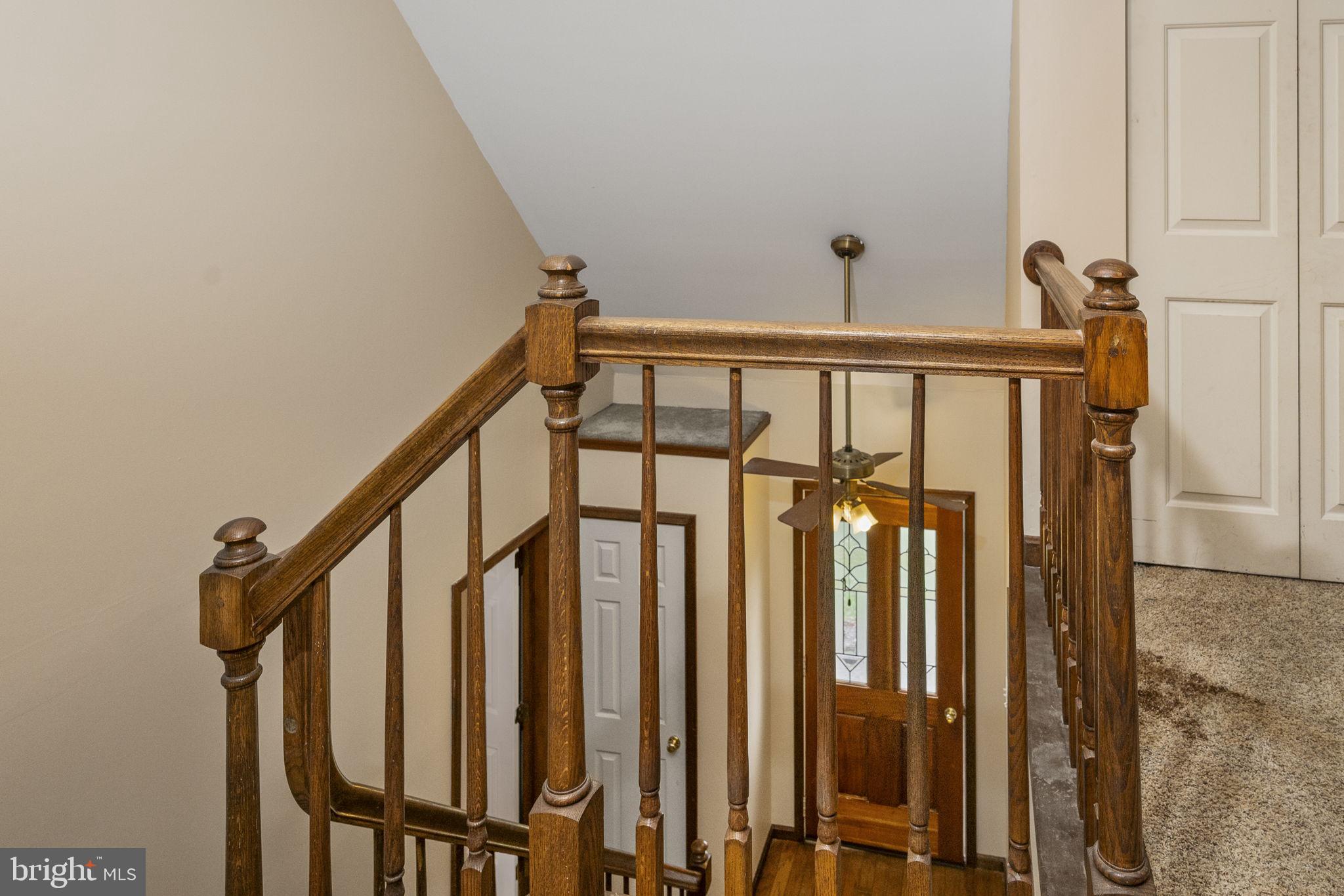 558 Crosswinds Drive Lititz, PA 17543 - Photo 20 of 31 a view of staircase with lots of frames on wall and a window