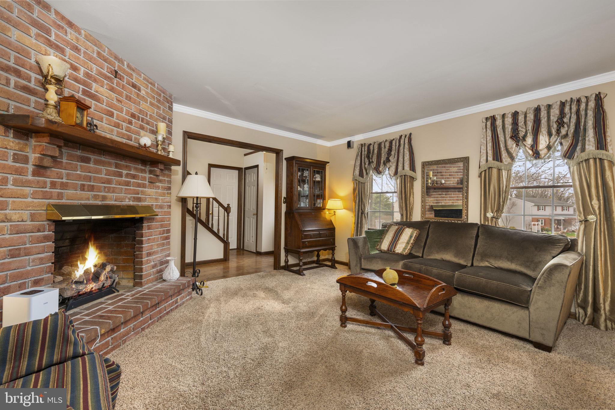 558 Crosswinds Drive Lititz, PA 17543 - Photo 5 of 31 a living room with furniture and a fireplace