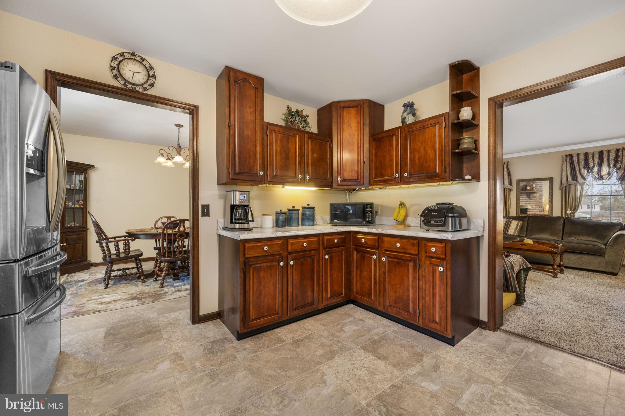 558 Crosswinds Drive Lititz, PA 17543 - Photo 8 of 31 a kitchen with stainless steel appliances granite countertop a sink and cabinets