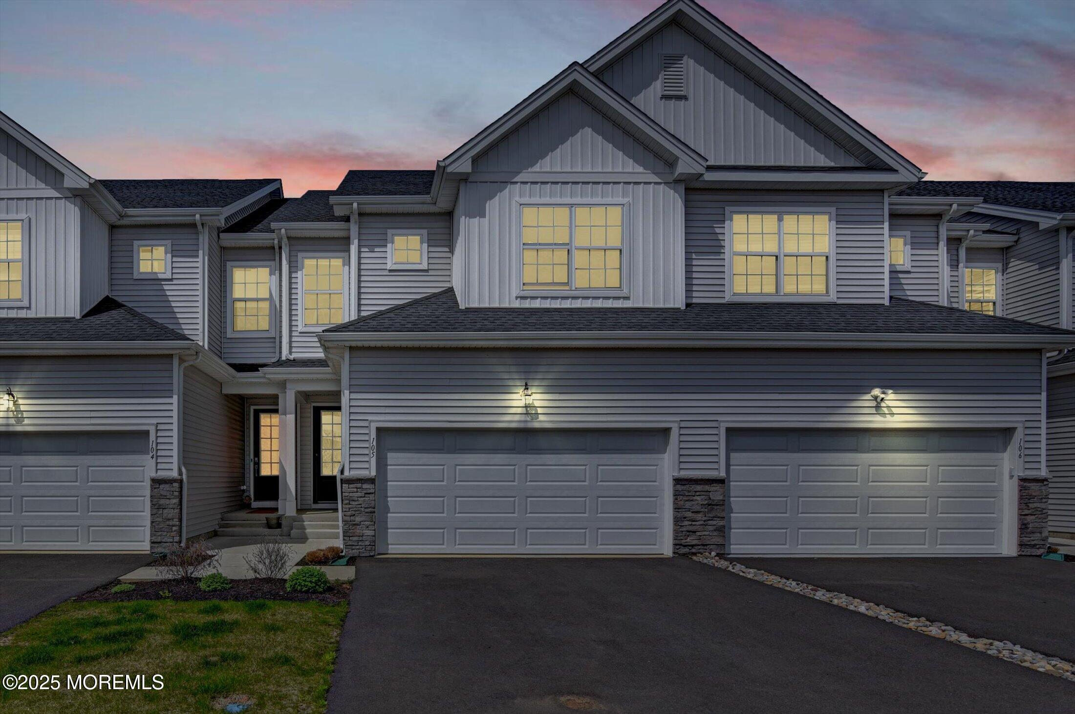 105 Pilot Street Marlboro, NJ 07746 - Photo 1 of 30 a front view of a house with a yard and garage