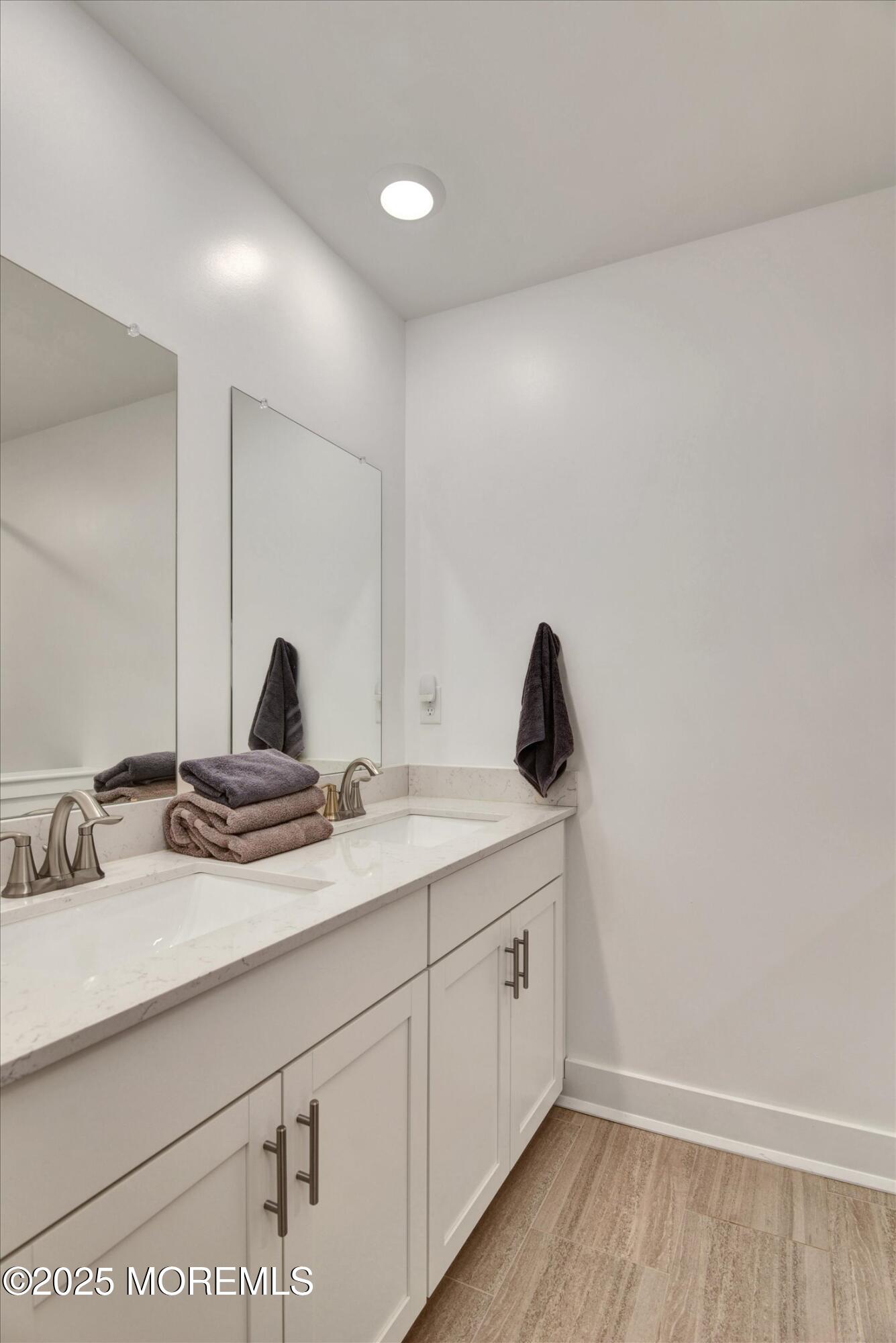 105 Pilot Street Marlboro, NJ 07746 - Photo 15 of 30 a bathroom with a double vanity sink and vanity