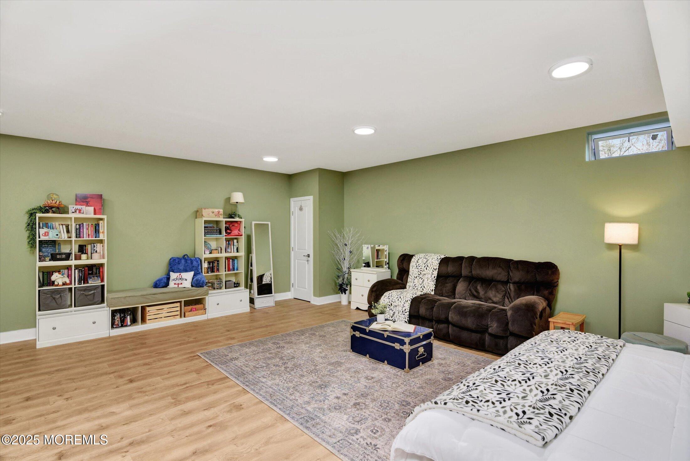 105 Pilot Street Marlboro, NJ 07746 - Photo 20 of 30 a living room with furniture and a wooden floor