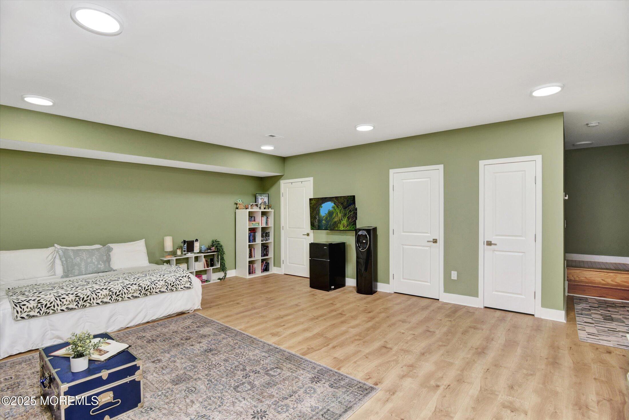 105 Pilot Street Marlboro, NJ 07746 - Photo 21 of 30 a living room with furniture and a flat screen tv