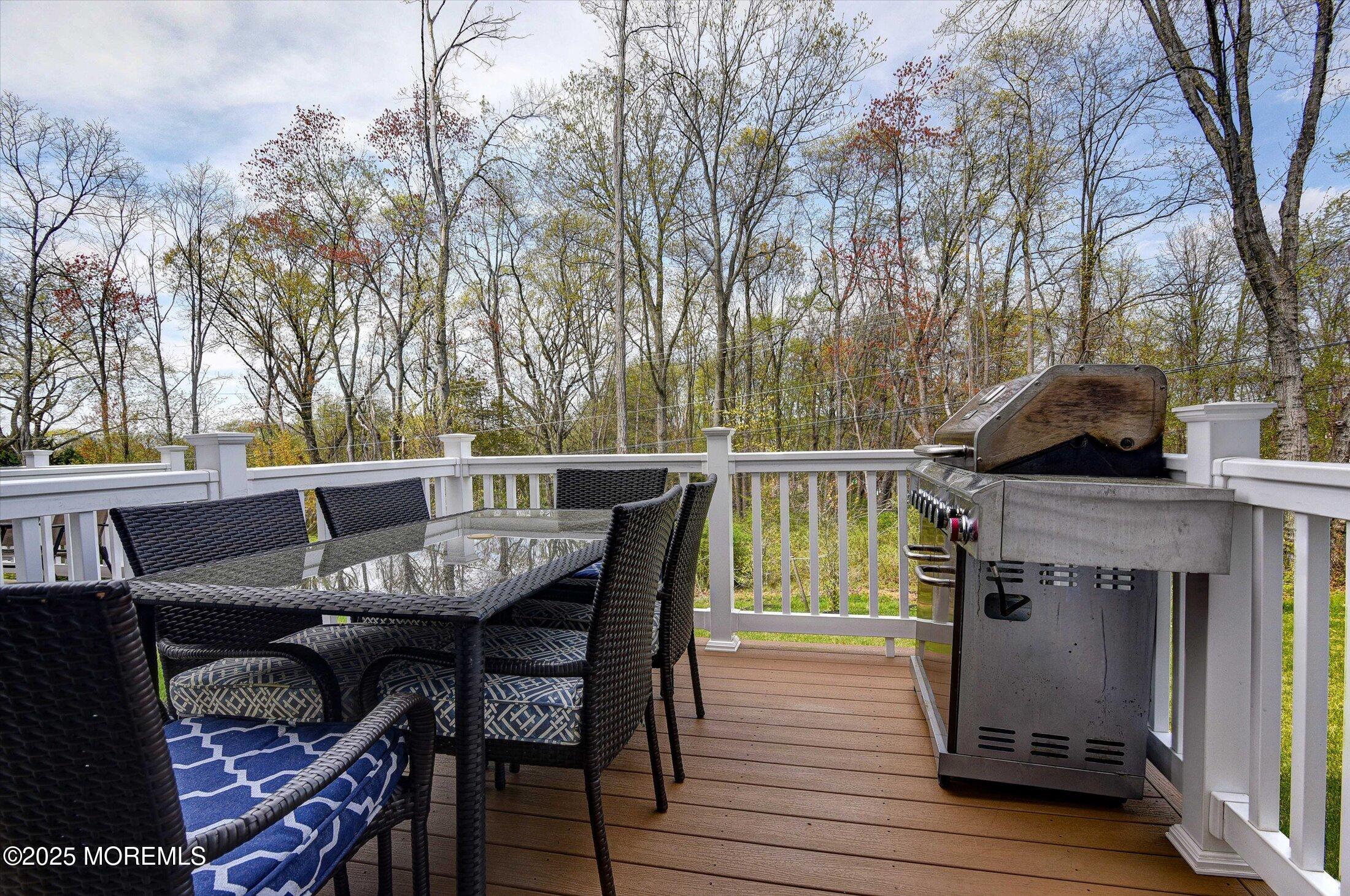 105 Pilot Street Marlboro, NJ 07746 - Photo 23 of 30 a view of a chairs and table on the deck