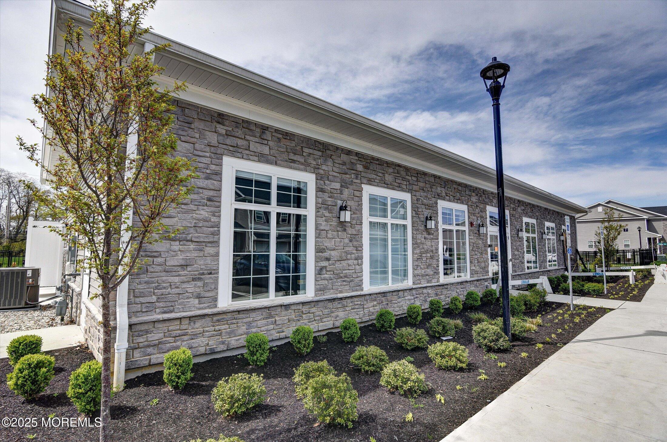 105 Pilot Street Marlboro, NJ 07746 - Photo 25 of 30 a front view of a house with a garden