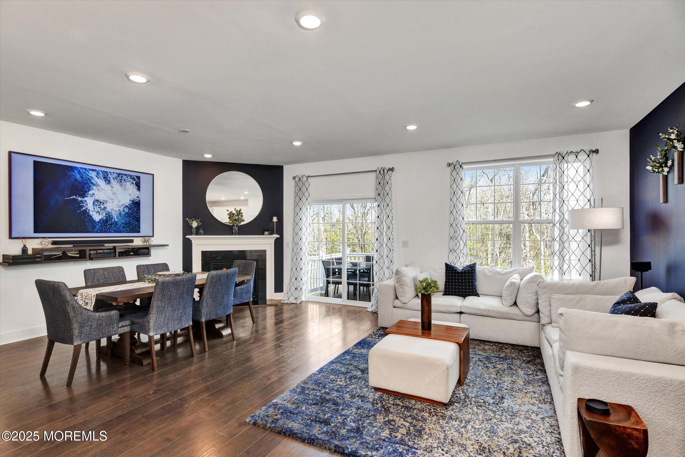 105 Pilot Street Marlboro, NJ 07746 - Photo 5 of 30 a living room with fireplace furniture and a flat screen tv
