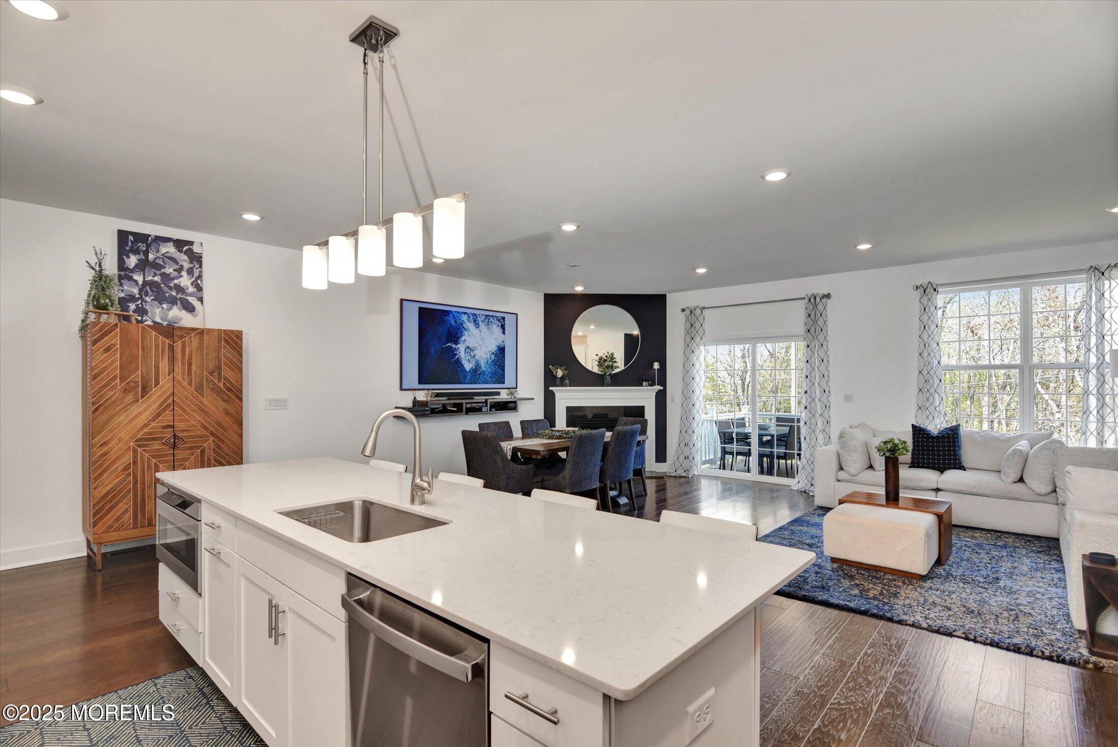 105 Pilot Street Marlboro, NJ 07746 - Photo 7 of 30 a view of kitchen with sink and living room