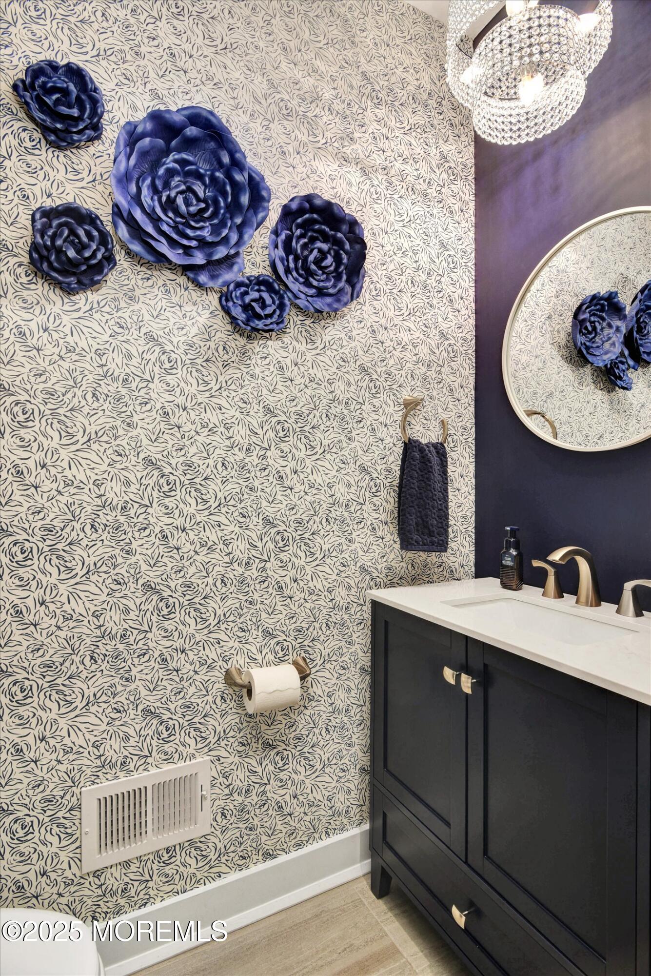 105 Pilot Street Marlboro, NJ 07746 - Photo 8 of 30 a bathroom with a sink a vanity and mirror