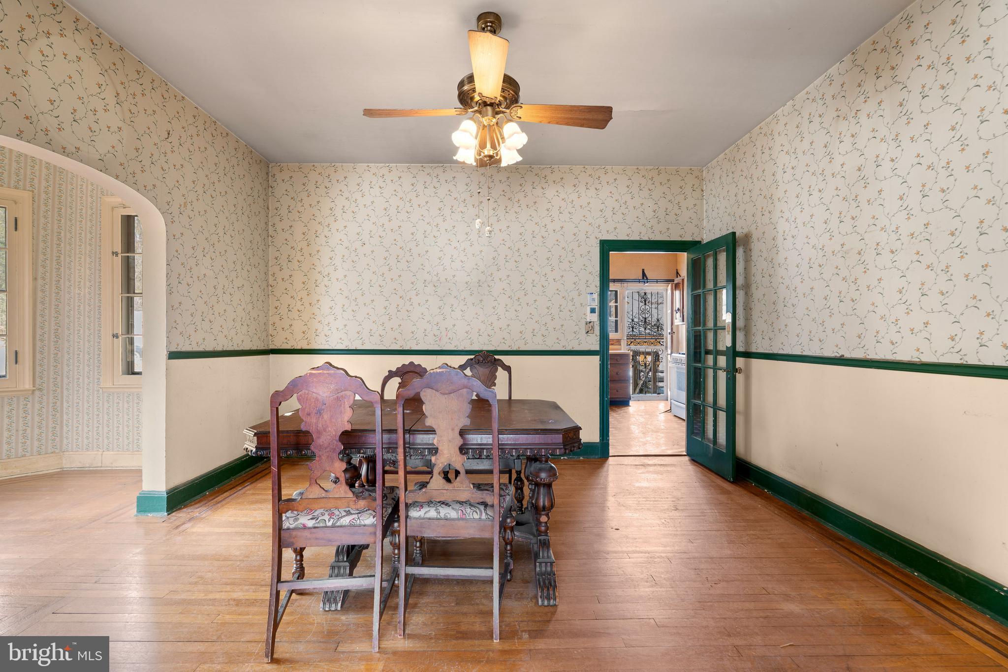 513 Stamford Road Baltimore, MD 21229 - Photo 6 of 20 a view of a dining room with furniture and wooden floor