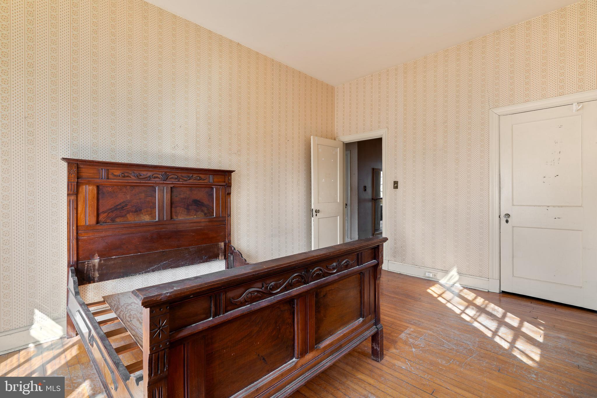 513 Stamford Road Baltimore, MD 21229 - Photo 10 of 20 a view of an empty room and wooden floor