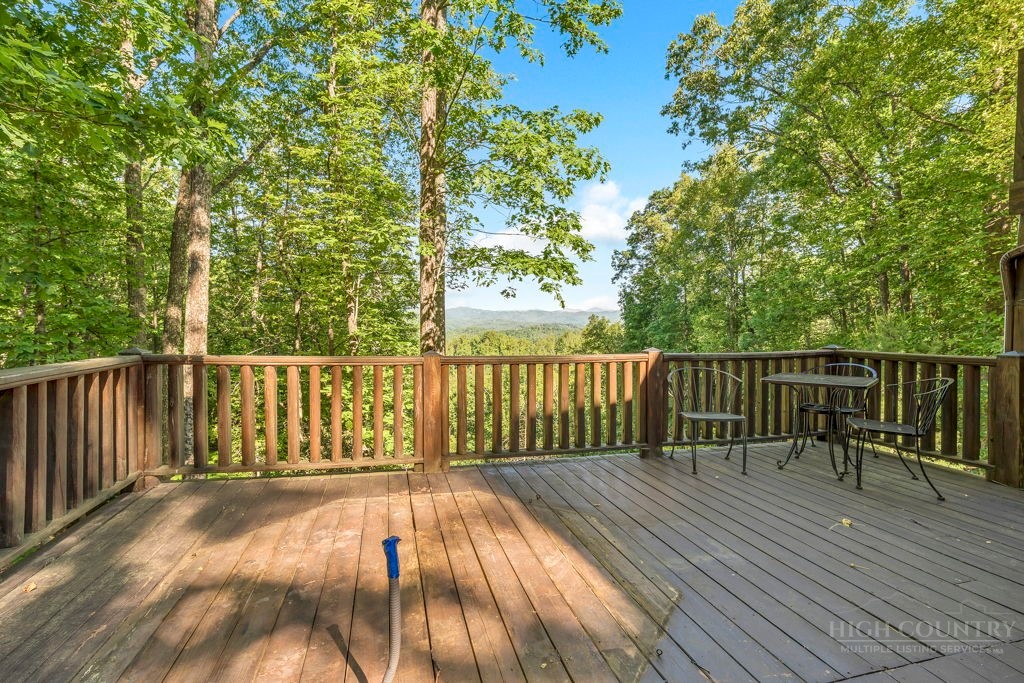 2229 Elk Ridge Road Ferguson, NC 28624 - Photo 40 of 42 a view of balcony with wooden floor and fence