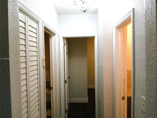 a bathroom with a shower and a mirror