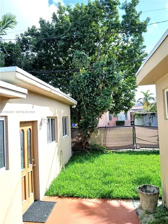 a view of backyard with a garden and plants