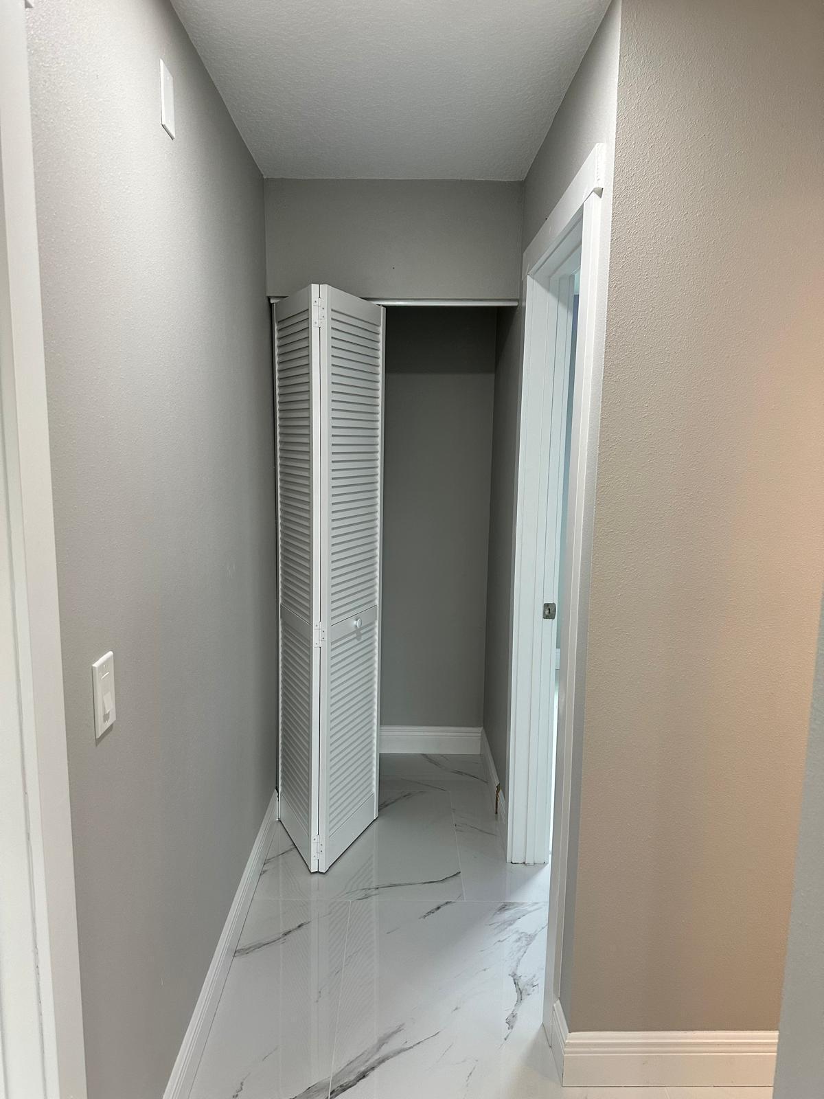 1398 Cromey Road Northeast Palm Bay, FL 32905 - Photo 26 of 36 an empty room with closet