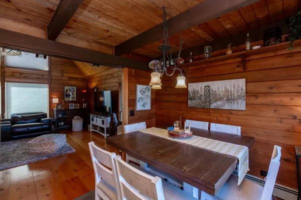 a bathroom with a granite countertop sink a mirror and shower