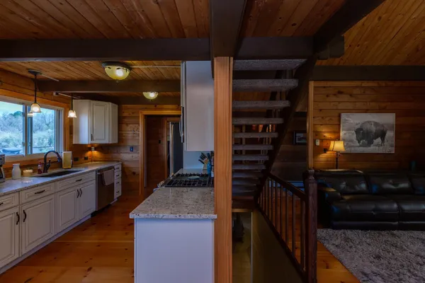 a kitchen with stainless steel appliances a refrigerator stove and microwave