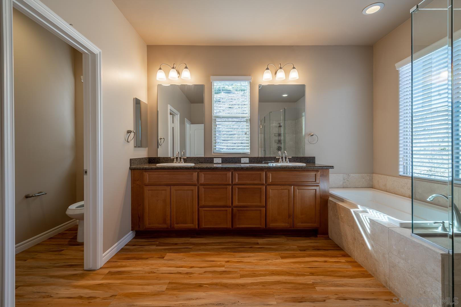 483 Alpine Trail Road Alpine, CA 91901 - Photo 34 of 42 a bathroom with a granite countertop sink and a mirror