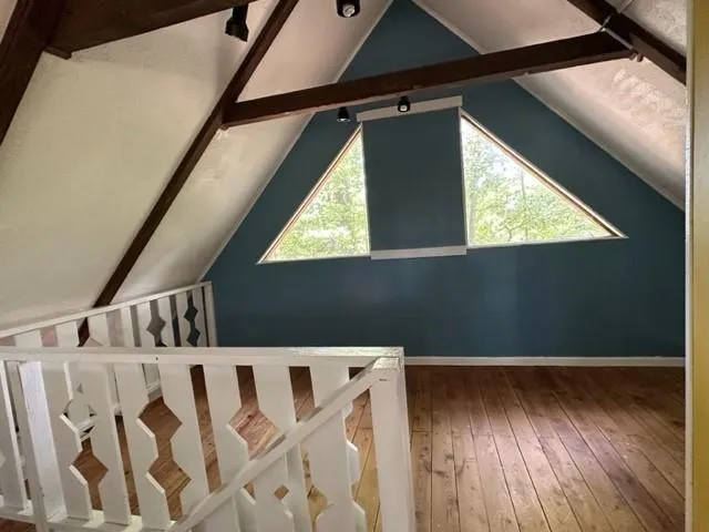 a view of wooden floor in an entryway