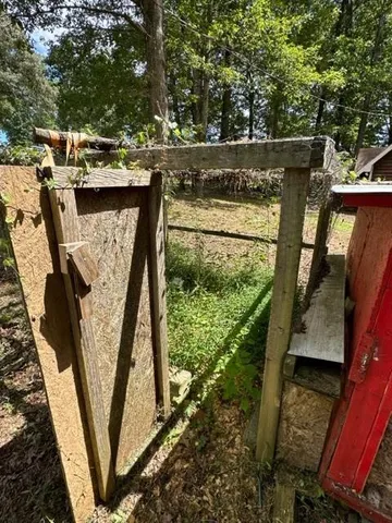 a view of swimming pool with a yard and furniture
