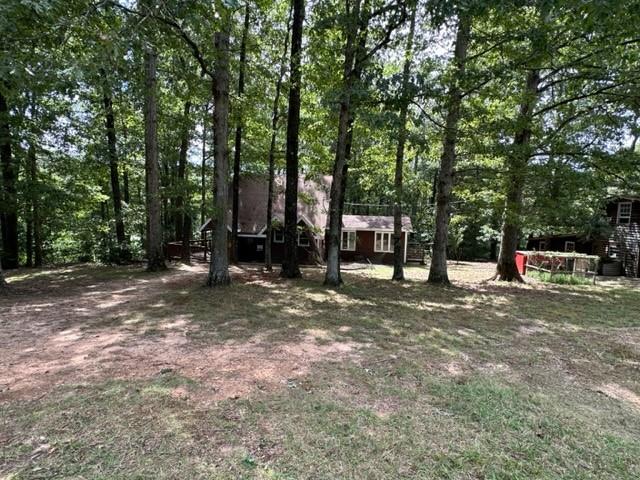441 Patrick Mill Road Southwest Winder, GA 30680 - Photo 16 of 19 a view of a outdoor space with trees