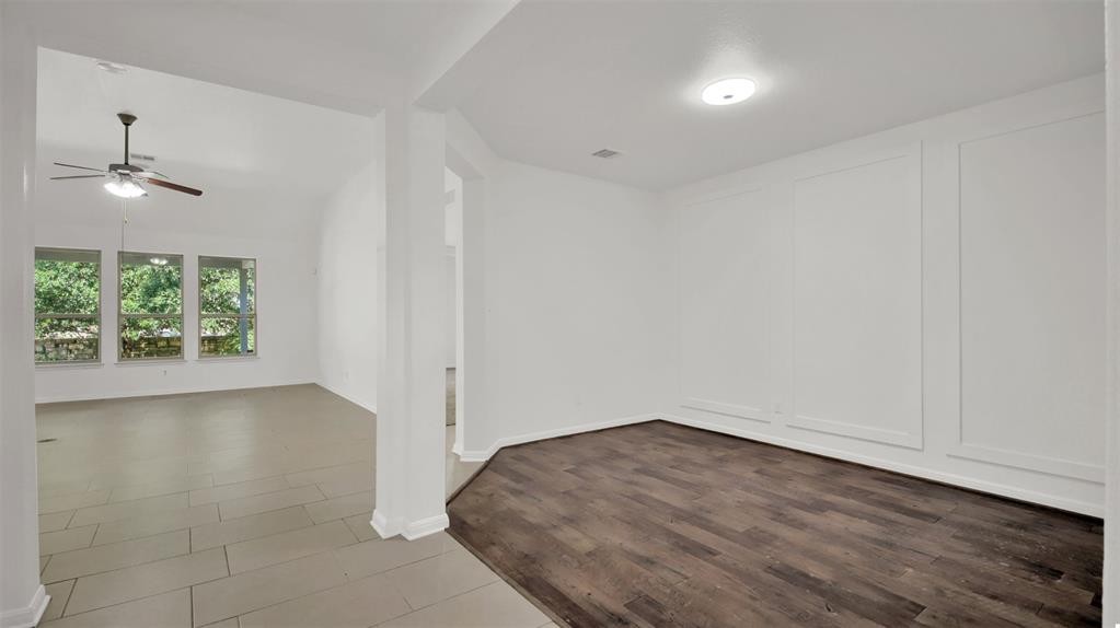 104 Lost Ridge Way Buda, TX 78610 - Photo 11 of 22 an empty room with a window and a ceiling fan