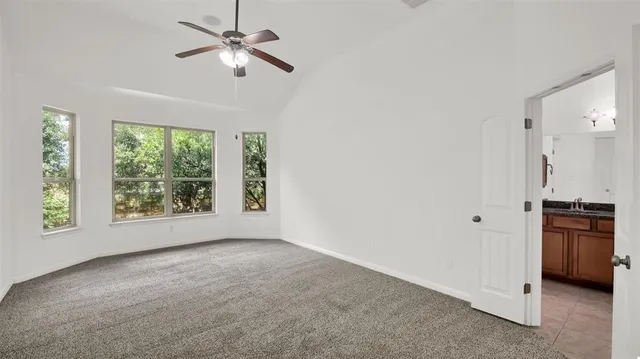 a view of a kitchen with a stove cabinets and a window