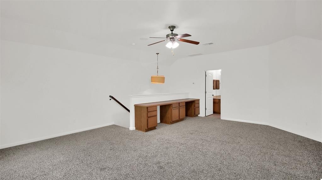 104 Lost Ridge Way Buda, TX 78610 - Photo 20 of 22 a view of an empty room with a fan