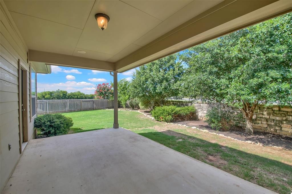 104 Lost Ridge Way Buda, TX 78610 - Photo 21 of 22 a view of a yard with porch
