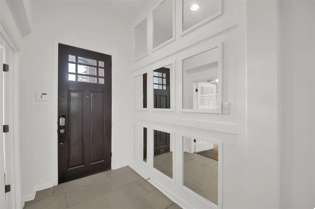 104 Lost Ridge Way Buda, TX 78610 - Photo 8 of 22 a view of a hallway with windows and cabinet
