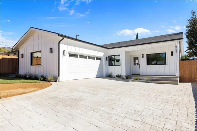 a front view of a house with a outdoor space