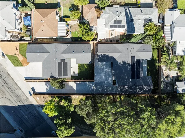 an aerial view of a house with a garden