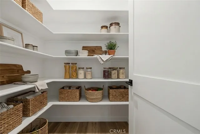 a living room with furniture and a book shelf