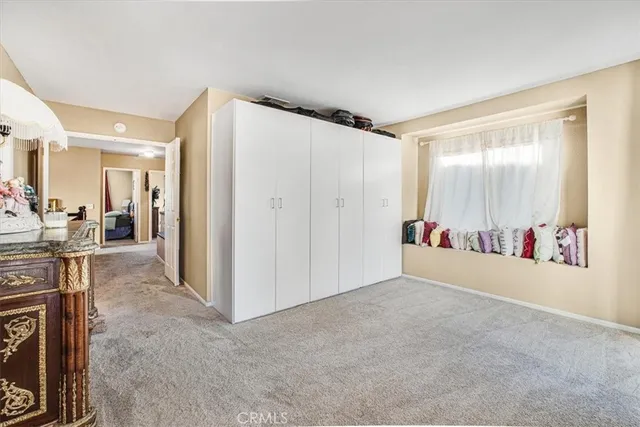 a view of livingroom with furniture and a window