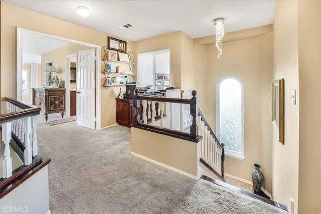 a view of living room with furniture and a window