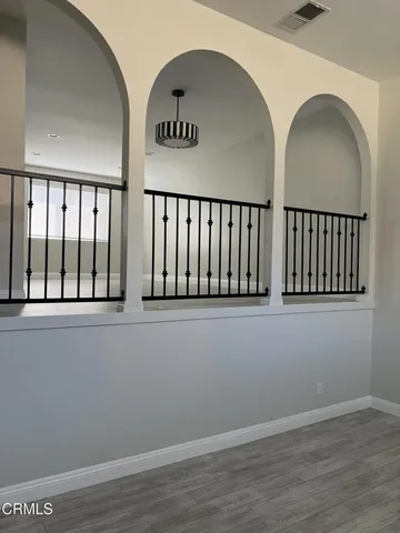 an entryway with wooden floor