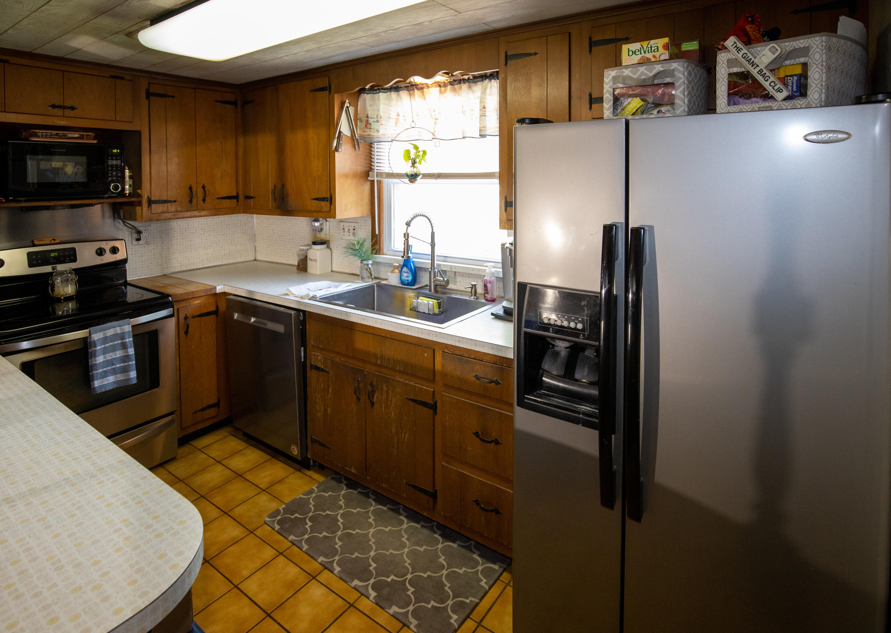 4 Smith Street Howell, NJ 07731 - Photo 14 of 27 a kitchen with stainless steel appliances granite countertop a sink stove and refrigerator