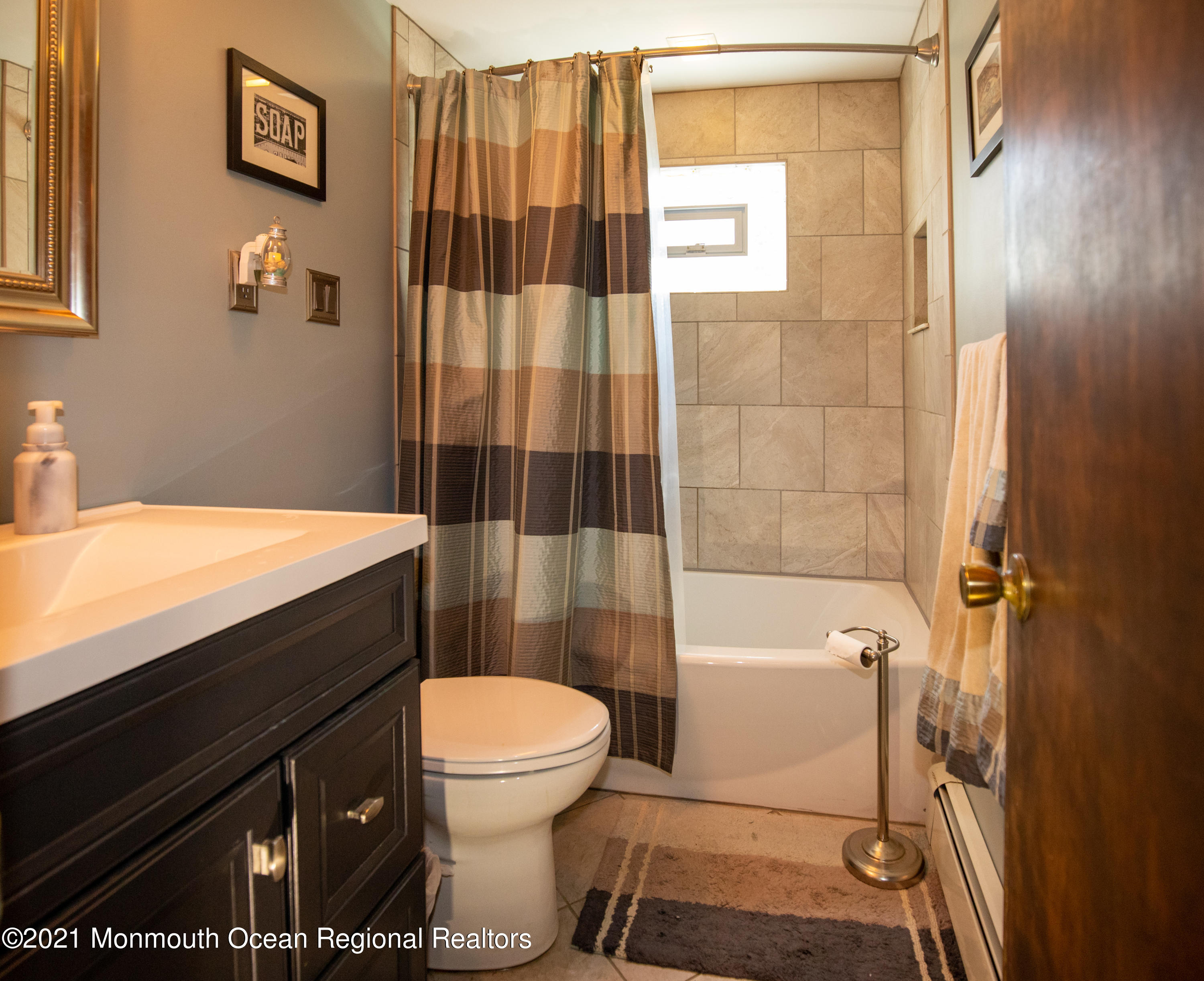 4 Smith Street Howell, NJ 07731 - Photo 19 of 27 a bathroom with a sink toilet vanity and shower