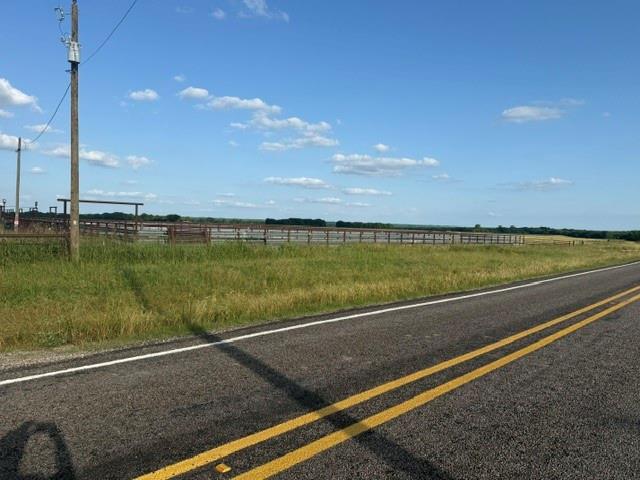 2-3 Fm 2815 Bonham, TX 75418 - Photo 5 of 11 Expansive grassy terrain featuring a perimeter fence and paved road access