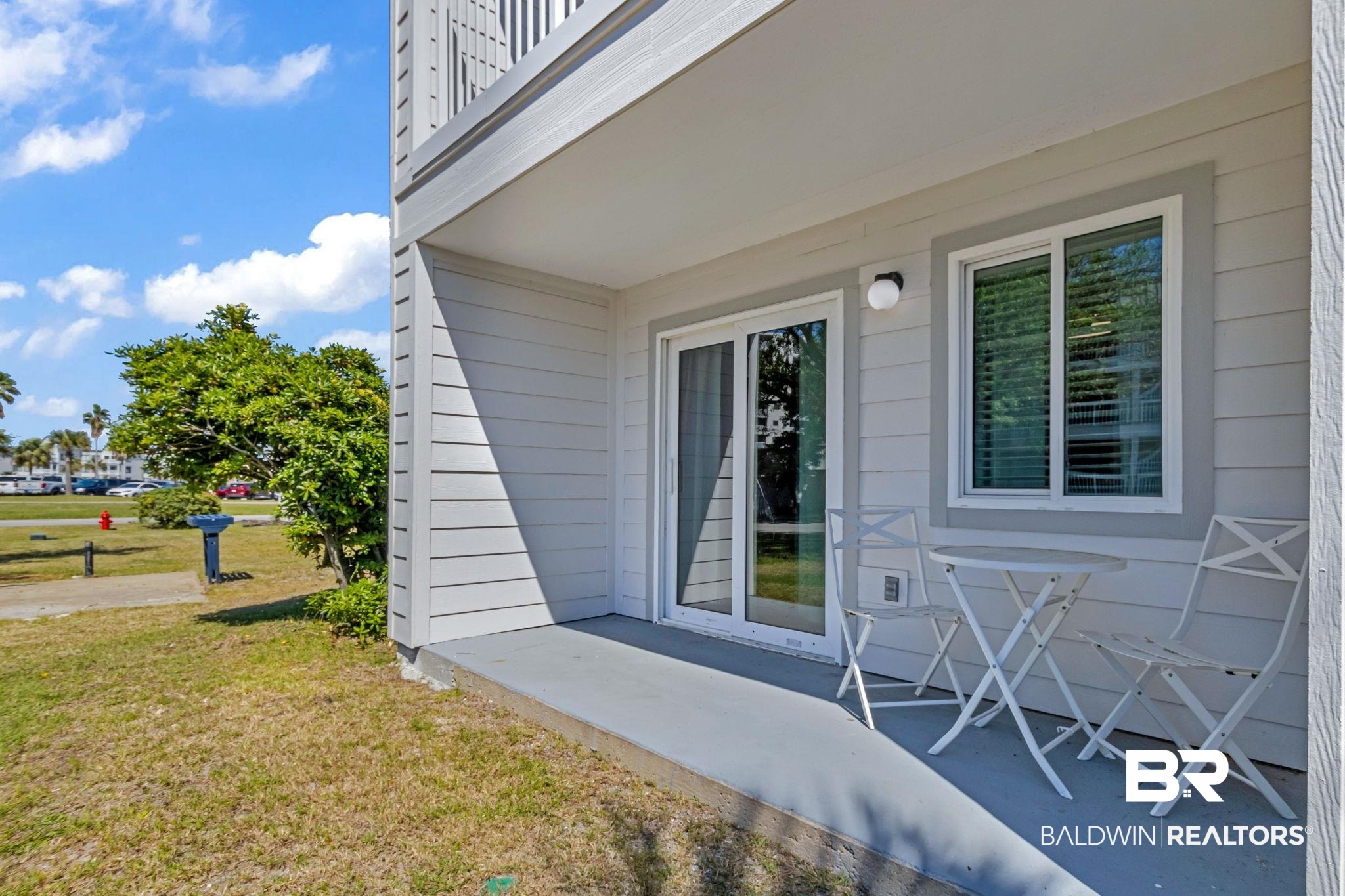 400 Plantation Road, Unit 4115 Gulf Shores, AL 36542 - Photo 24 of 48 View of exterior entry with a patio and a yard