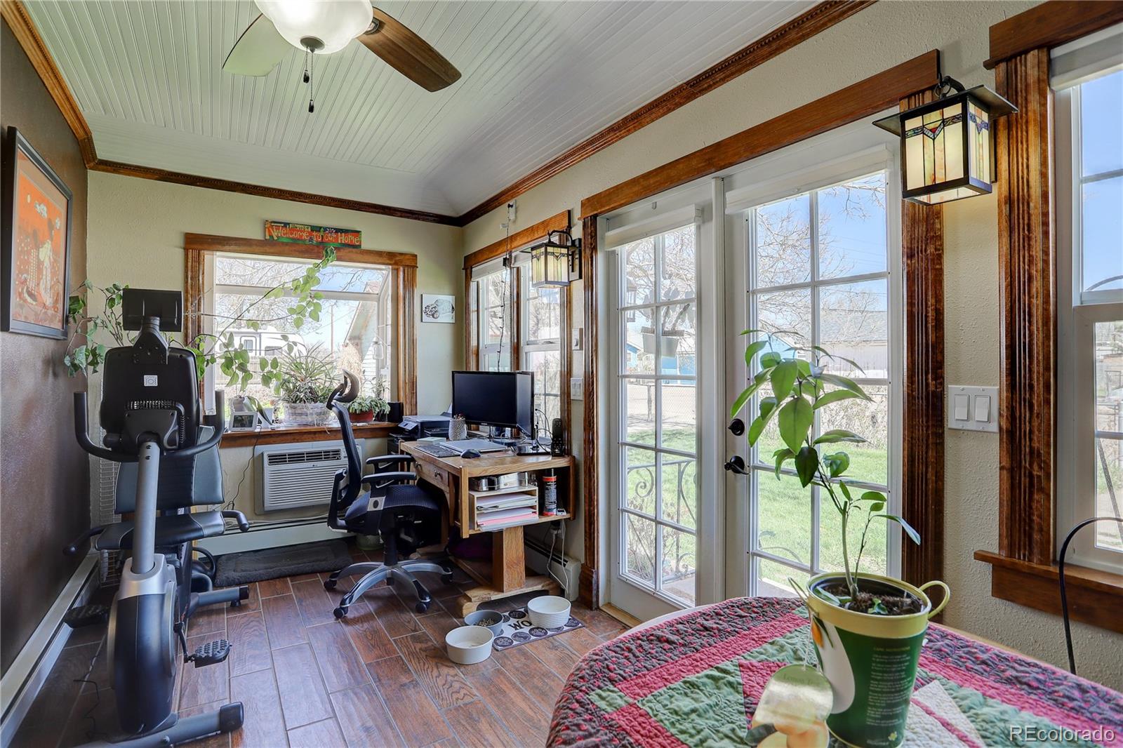 153 Park Avenue Fort Lupton, CO 80621 - Photo 16 of 35 a view of a workspace with furniture and a window