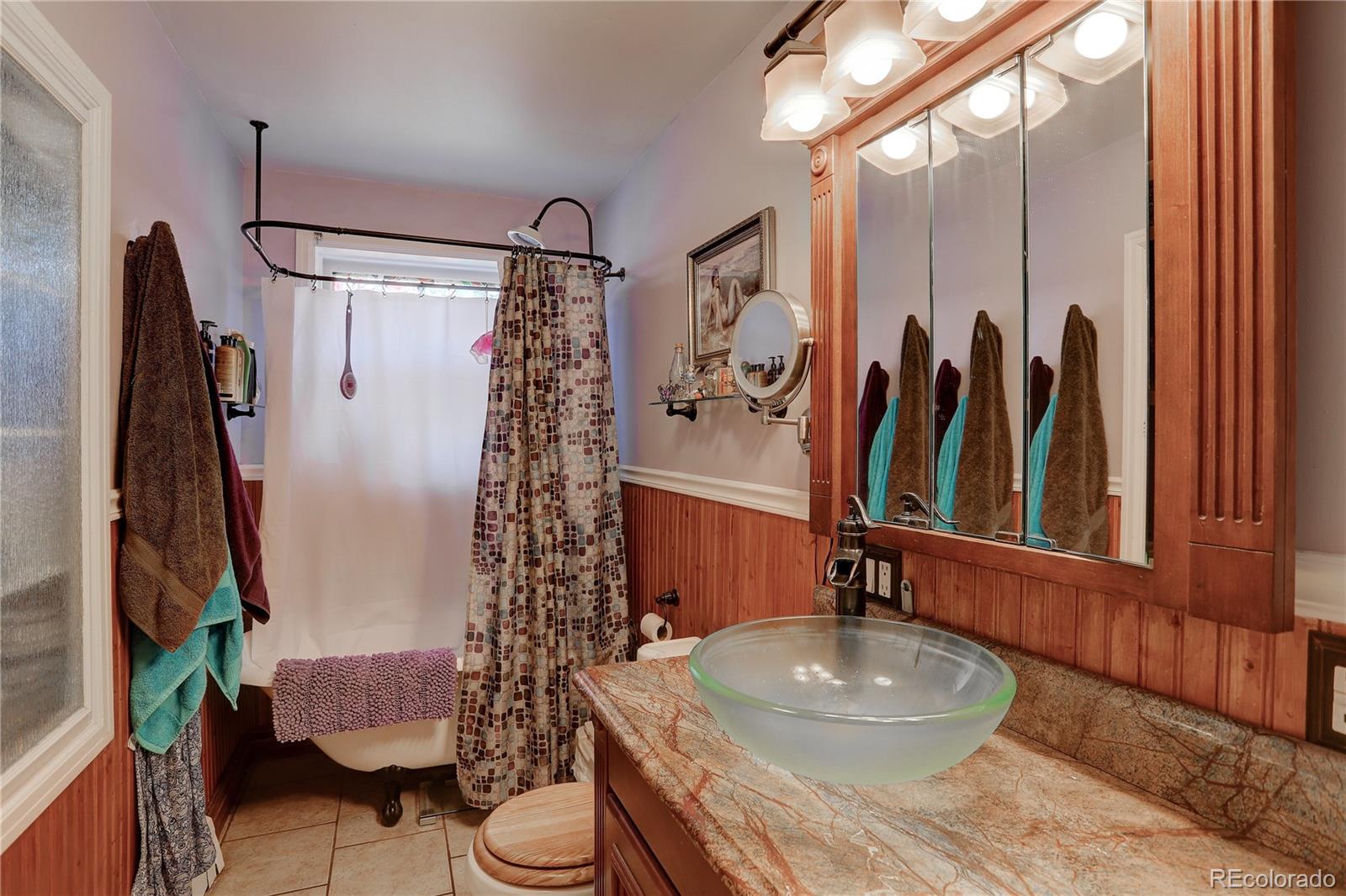 153 Park Avenue Fort Lupton, CO 80621 - Photo 20 of 35 a bathroom with a sink toilet and shower