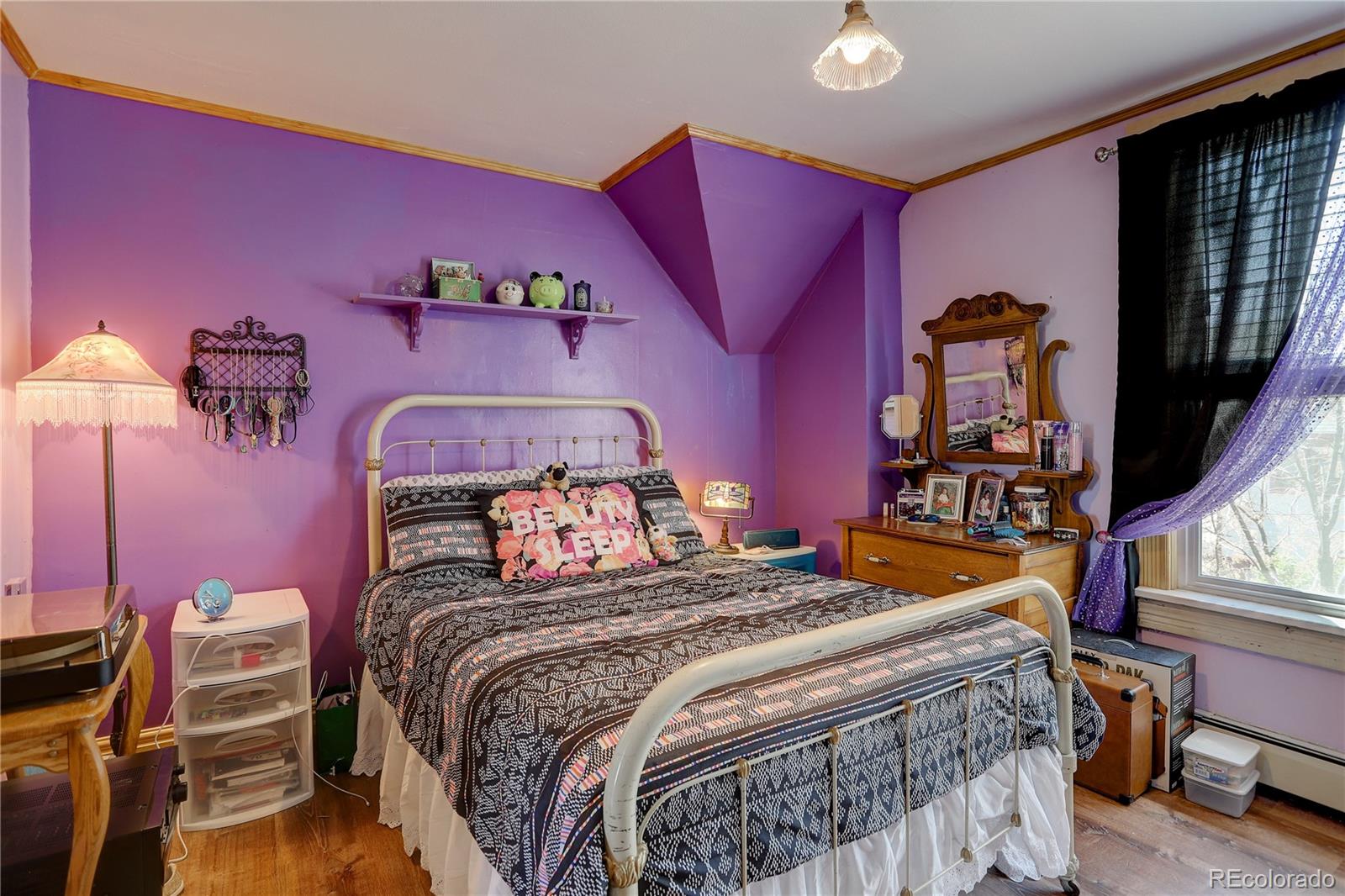 153 Park Avenue Fort Lupton, CO 80621 - Photo 24 of 35 a bedroom with a bed and a closet