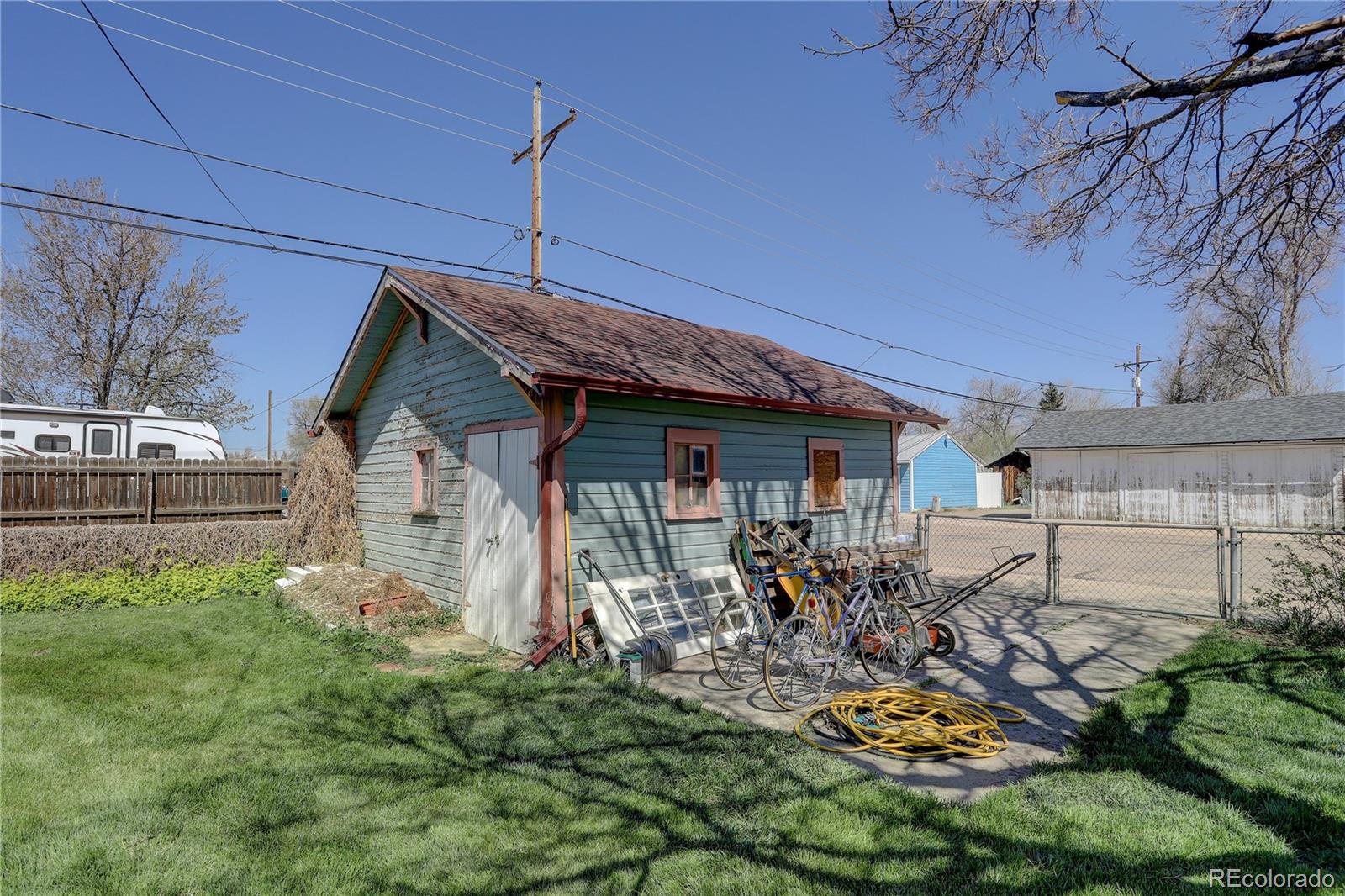 153 Park Avenue Fort Lupton, CO 80621 - Photo 29 of 35 a front view of a house with garden