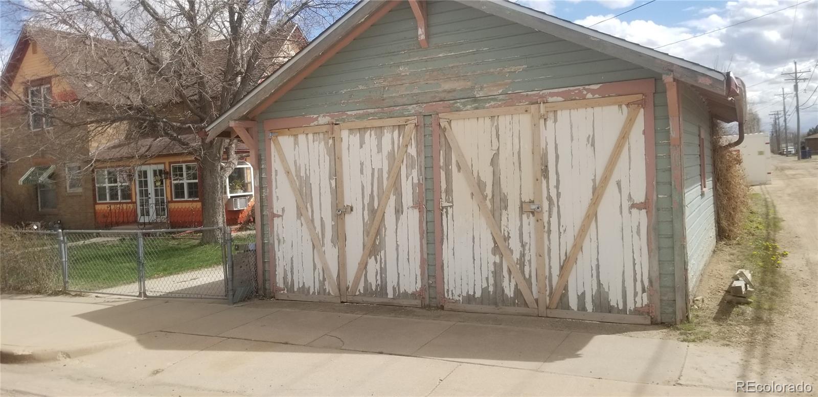 153 Park Avenue Fort Lupton, CO 80621 - Photo 30 of 35 a front view of a house with a garden