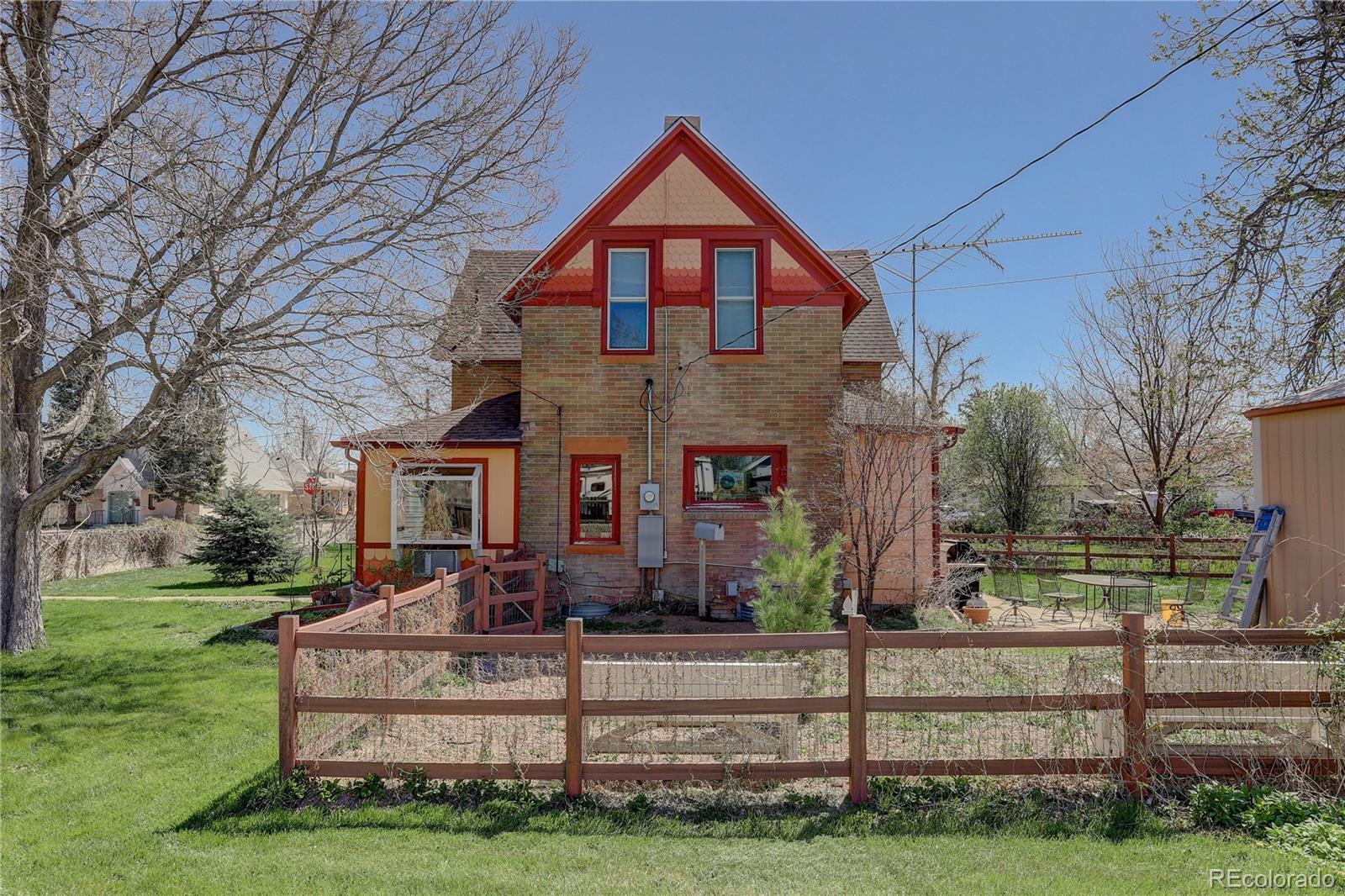 153 Park Avenue Fort Lupton, CO 80621 - Photo 34 of 35 a front view of house with yard