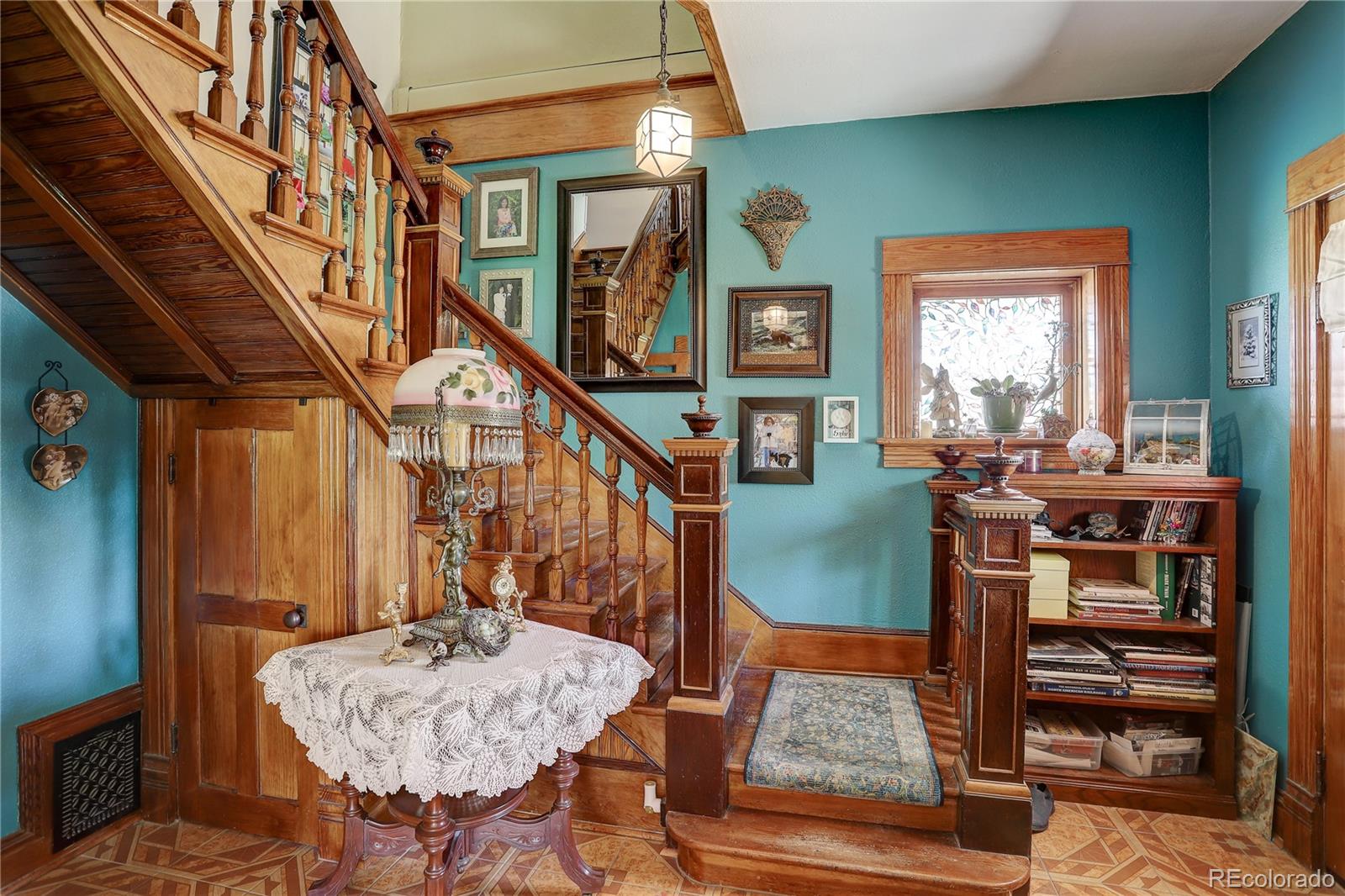 153 Park Avenue Fort Lupton, CO 80621 - Photo 4 of 35 a living room with furniture and a rug