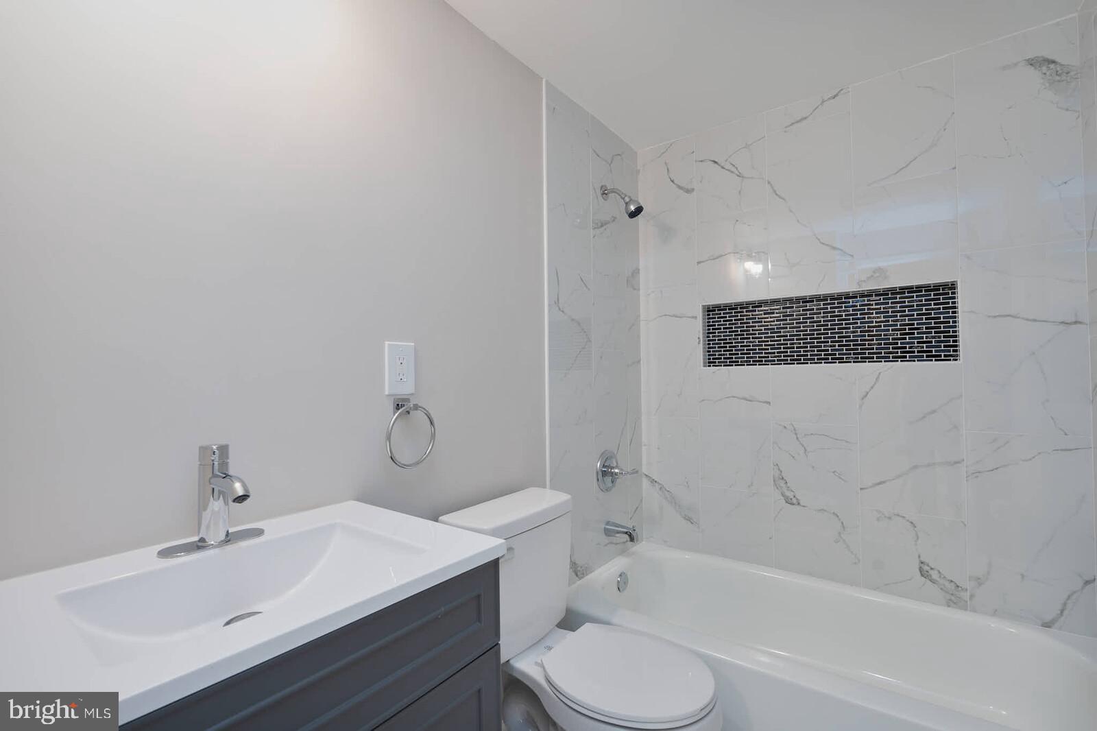 1842 Dutch Village Drive, Unit R264 Landover, MD 20785 - Photo 11 of 26 a bathroom with a sink toilet and shower
