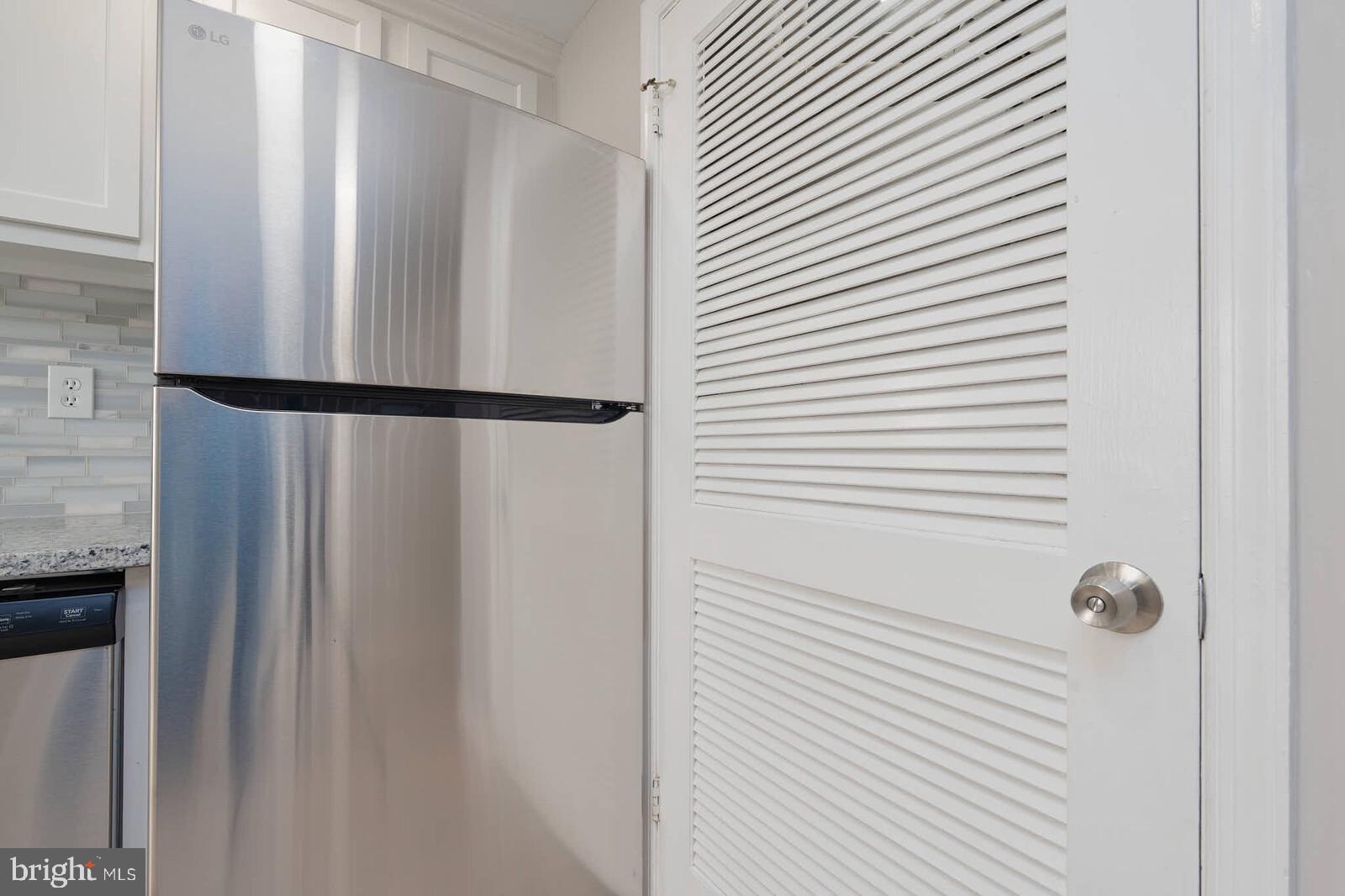 1842 Dutch Village Drive, Unit R264 Landover, MD 20785 - Photo 10 of 26 a white refrigerator freezer and a dishwasher